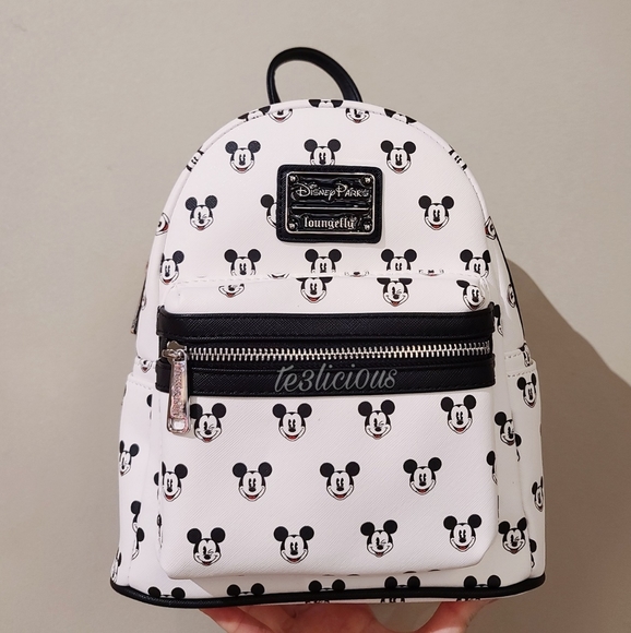 Disney Handbags - DISNEY LOUNGEFLY ALL OVER MICKEY'S FACE BACKPACK